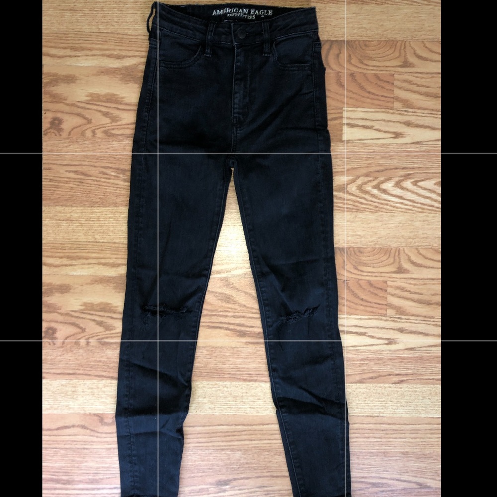 Black skinny jeans with rips in knee